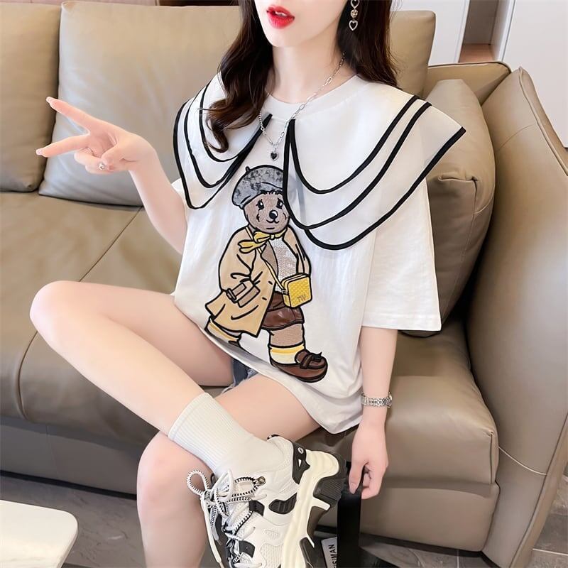 カレッジスタイルのゆったりとしたウエスタンスタイルのネイビーカラー漫画柄Tシャ<S-2897>